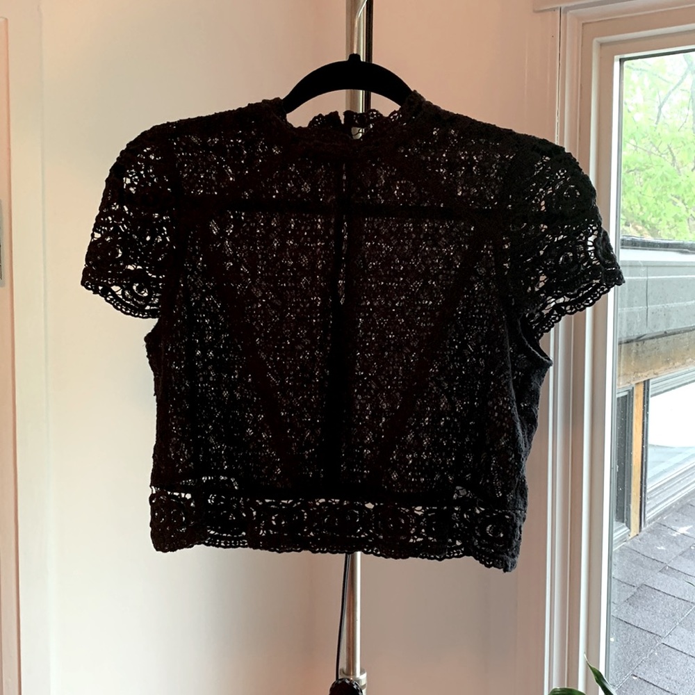 Adorable crochet crop top with high collar and back buttons.